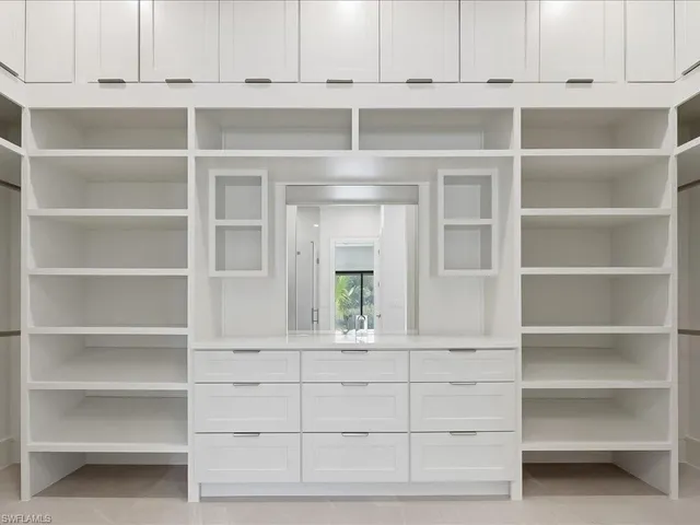 a bathroom with a white tub shower