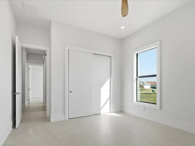 a view of an empty room with windows