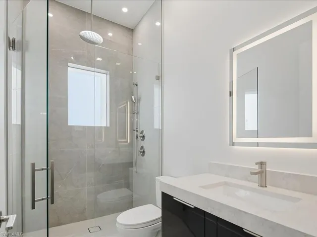 a view of an empty room with windows