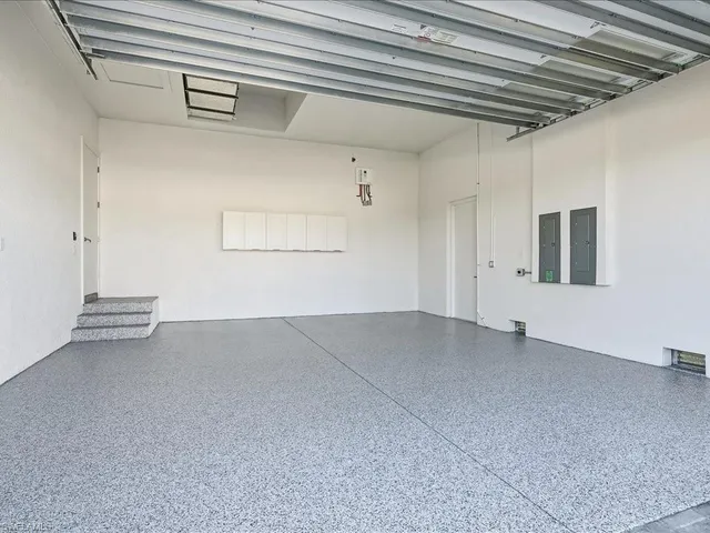 a kitchen with a refrigerator and a sink
