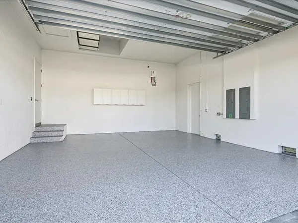 a kitchen with a refrigerator and a sink