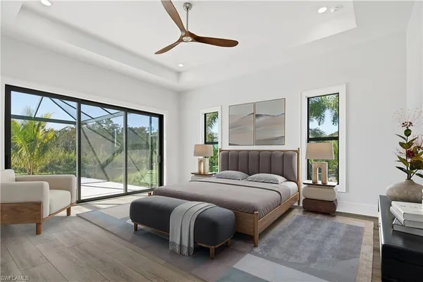 a bedroom with a large bed and a large window