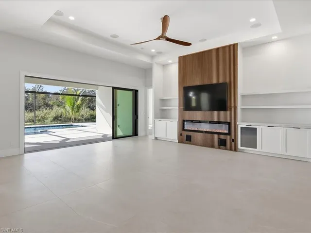 a view of a livingroom with furniture and a flat screen tv