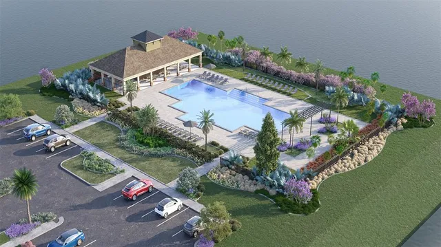 a view of a swimming pool with a yard