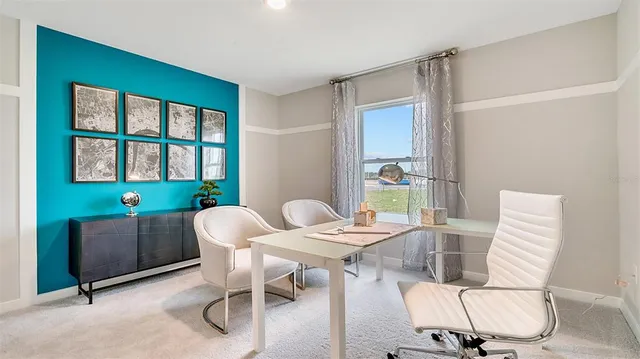 a view of a dining room with furniture window and outside view