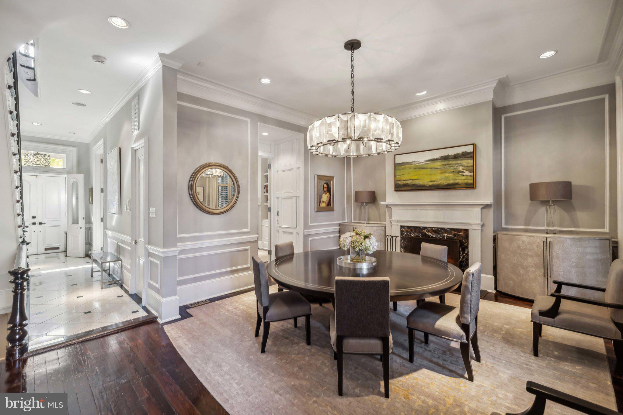 1213 O Street Northwest Washington, DC 20005 - Photo 9 of 29 a view of a dining room and livingroom with furniture wooden floor a chandelier