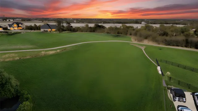 a view of a green field with clear sky