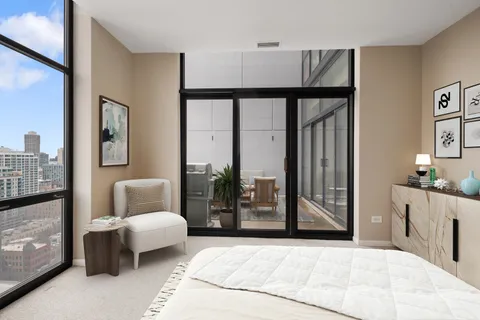 a bedroom with furniture and a window