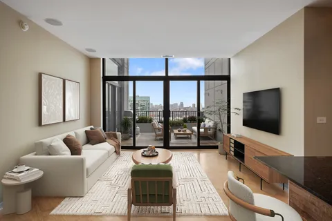 a living room with furniture a flat screen tv and a floor to ceiling window