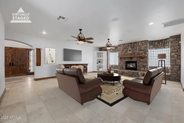 a view of empty room with a fireplace