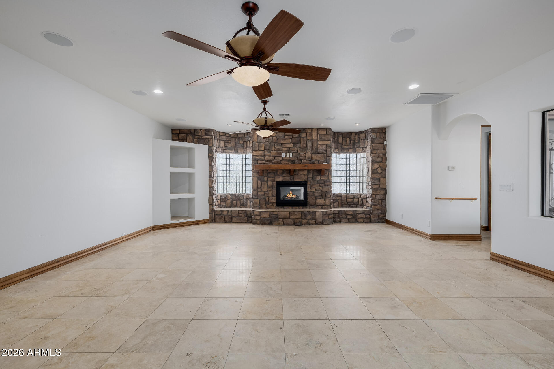 1815 West Maddock Road Phoenix, AZ 85086 - Photo 22 of 71 an empty room with windows and fireplace
