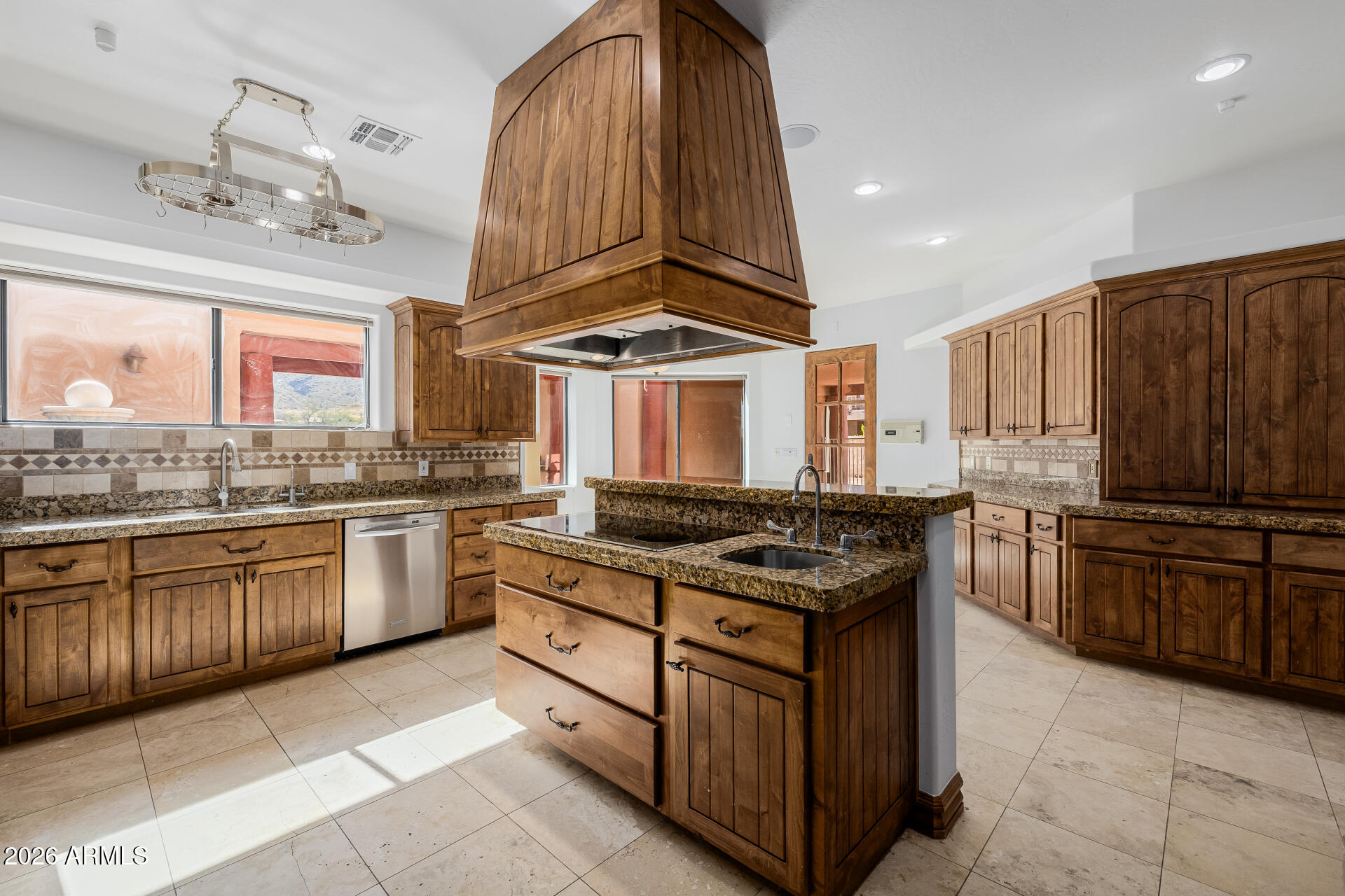 1815 West Maddock Road Phoenix, AZ 85086 - Photo 28 of 71 a kitchen with stainless steel appliances granite countertop a stove and a sink