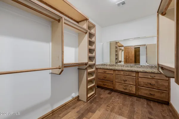 a bathroom with a tub sink and shower