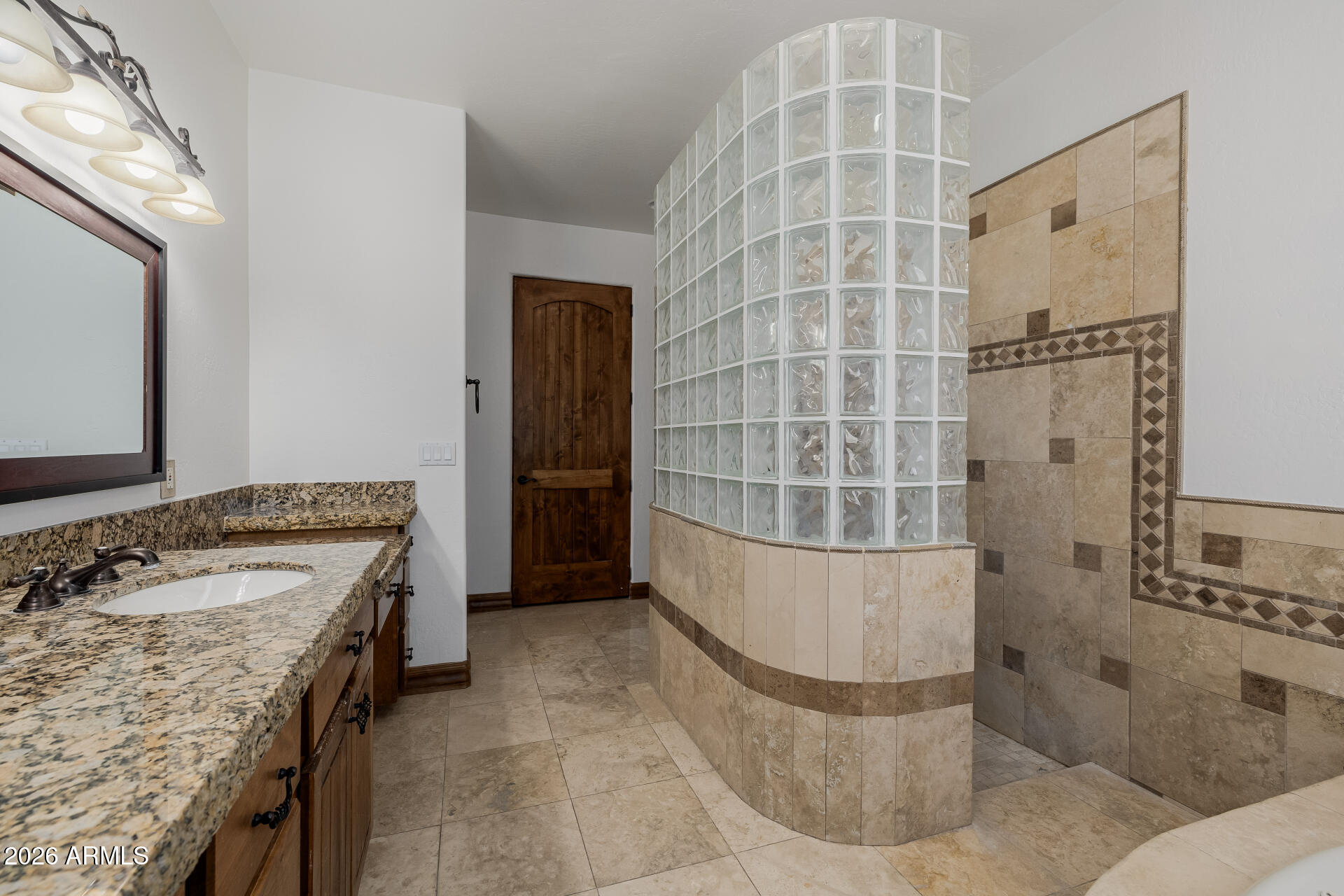 1815 West Maddock Road Phoenix, AZ 85086 - Photo 37 of 71 a bathroom with a tub sink and shower