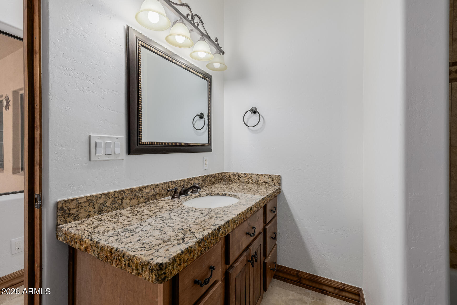 1815 West Maddock Road Phoenix, AZ 85086 - Photo 51 of 71 a bathroom with a granite countertop sink and a mirror