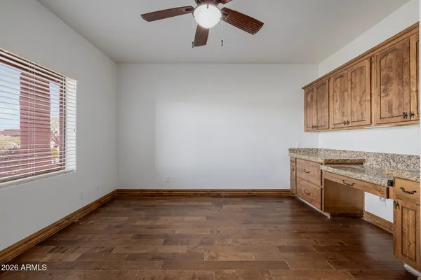 a view of an empty room with a fireplace