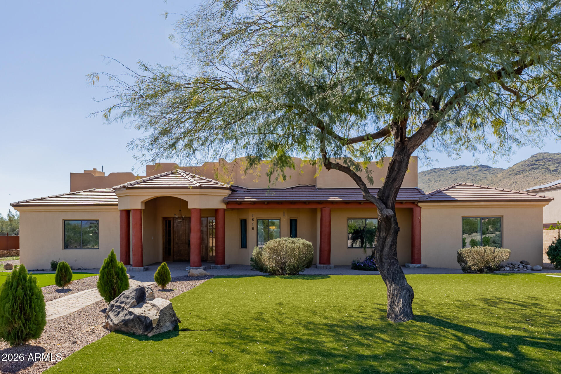 1815 West Maddock Road Phoenix, AZ 85086 - Photo 6 of 71 a view of a chair and table in backyard of the house