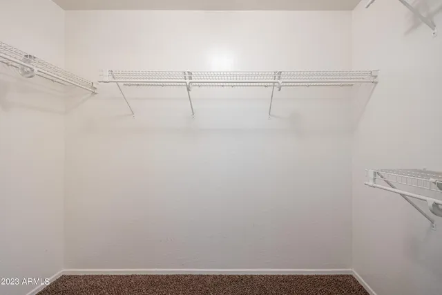 a view of room with window and ceiling fan