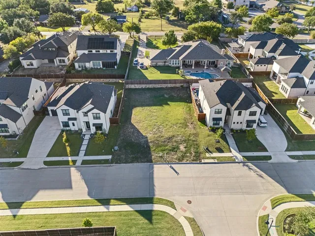 an aerial view of a house with a swimming pool