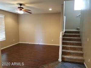 952 South Adam Way Gilbert, AZ 85296 - Photo 3 of 8 wooden floor in an empty room with a window