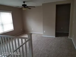 a kitchen with a sink and a mirror