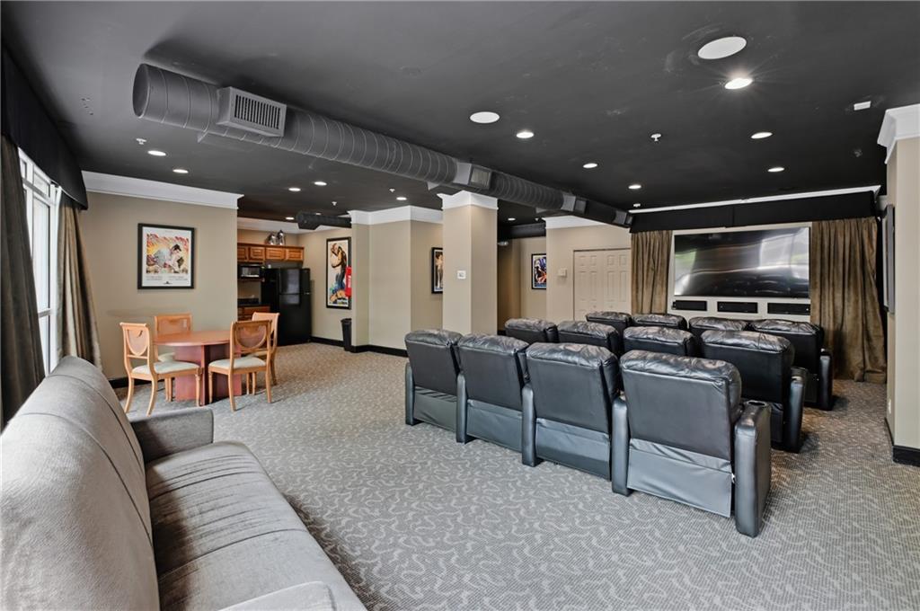 10 Perimeter Summit Boulevard, Unit 3311 Atlanta, GA 30319 - Photo 23 of 68 a living room with furniture and a flat screen tv