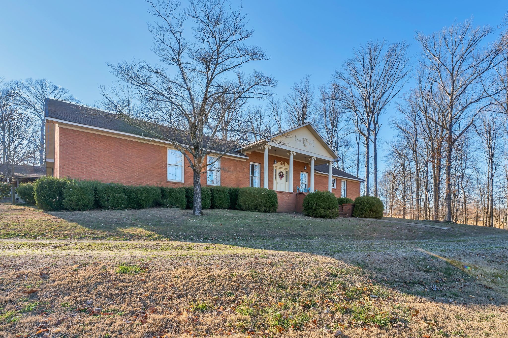 729 Rabbit Trail Road Leoma, TN 38468 - Photo 3 of 52 a front view of a house with a yard