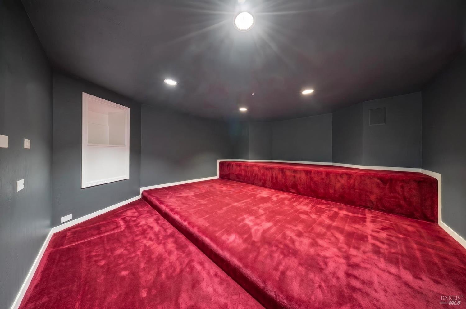 10 Lockton Lane Novato, CA 94945 - Photo 48 of 68 Dedicated movie theater room with dark finishes, theater seating, and a screen wall for at-home film nights, sports, and entertainment.