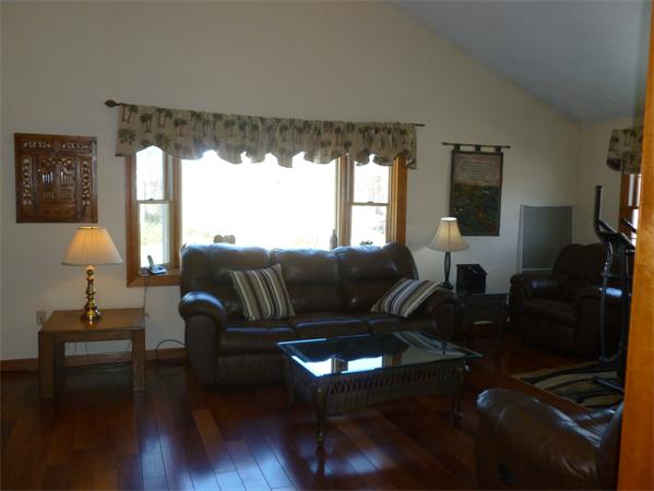 15 Gov Doherty Road Billerica, MA 01821 - Photo 16 of 30 a living room with furniture and a lamp