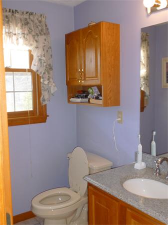 15 Gov Doherty Road Billerica, MA 01821 - Photo 20 of 30 a bathroom with a granite countertop toilet sink and mirror