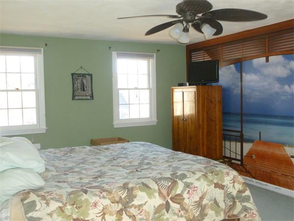 15 Gov Doherty Road Billerica, MA 01821 - Photo 21 of 30 a bedroom with a bed and a chandelier