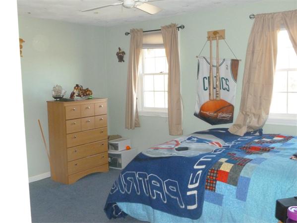 15 Gov Doherty Road Billerica, MA 01821 - Photo 24 of 30 a bedroom with a bed and a window