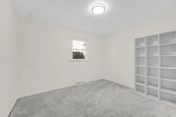 an empty room with a empty space and empty shelves