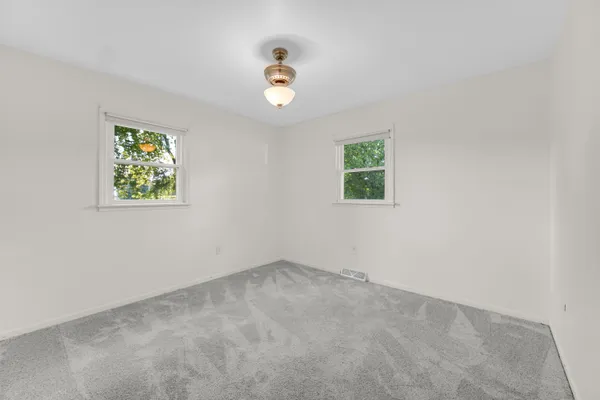 an empty room with windows