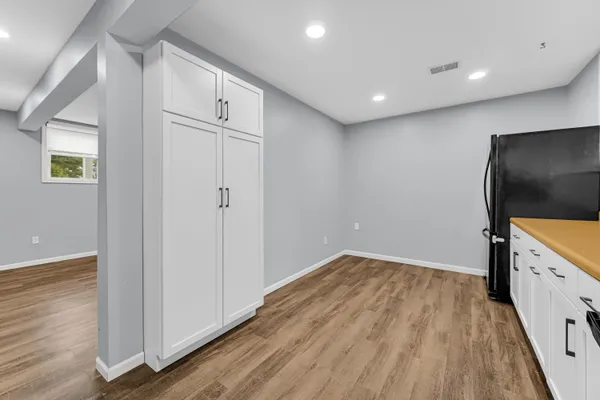 a view of a livingroom with wooden floor