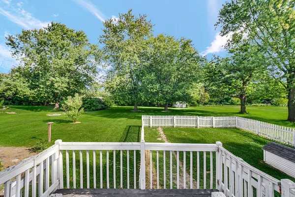 a view of a deck and a garden