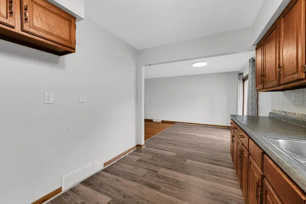 a view of a kitchen from the hallway