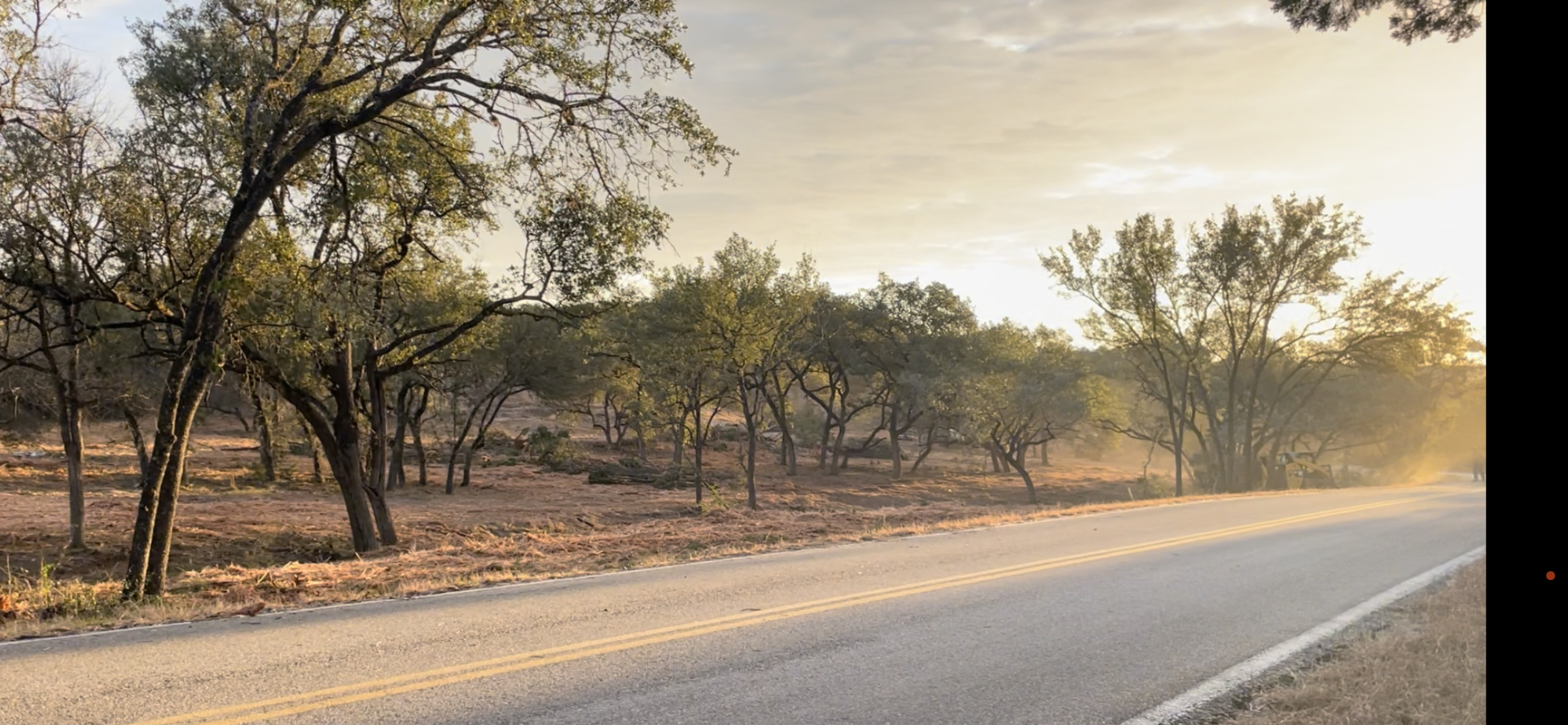 19732 Thurman Bend Road Spicewood, TX 78669 - Photo 1 of 2 a view of a house with a snow on the road