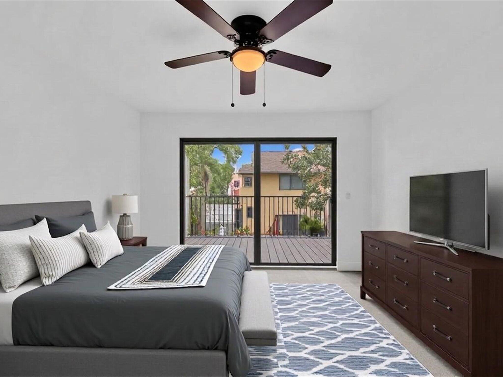 3841 Farragut Street Hollywood, FL 33021 - Photo 15 of 47 a bedroom with a bed and a flat tv screen on dresser