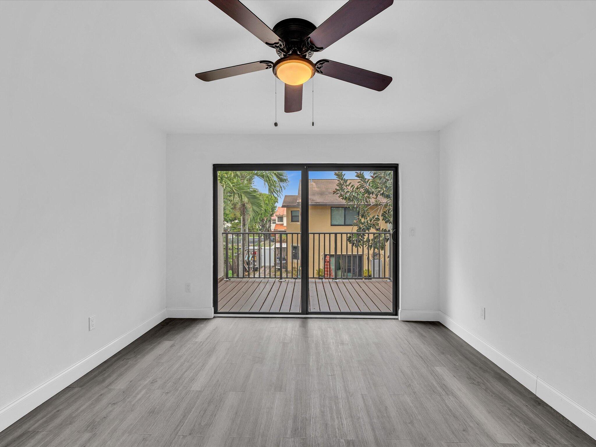 3841 Farragut Street Hollywood, FL 33021 - Photo 16 of 47 wooden floor in an empty room with a window