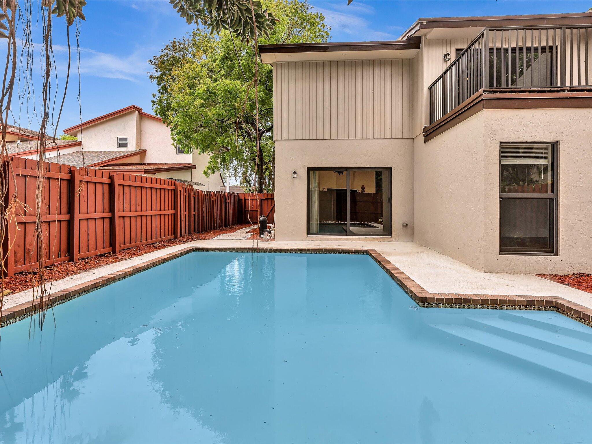 3841 Farragut Street Hollywood, FL 33021 - Photo 2 of 47 a view of a house with pool and a yard