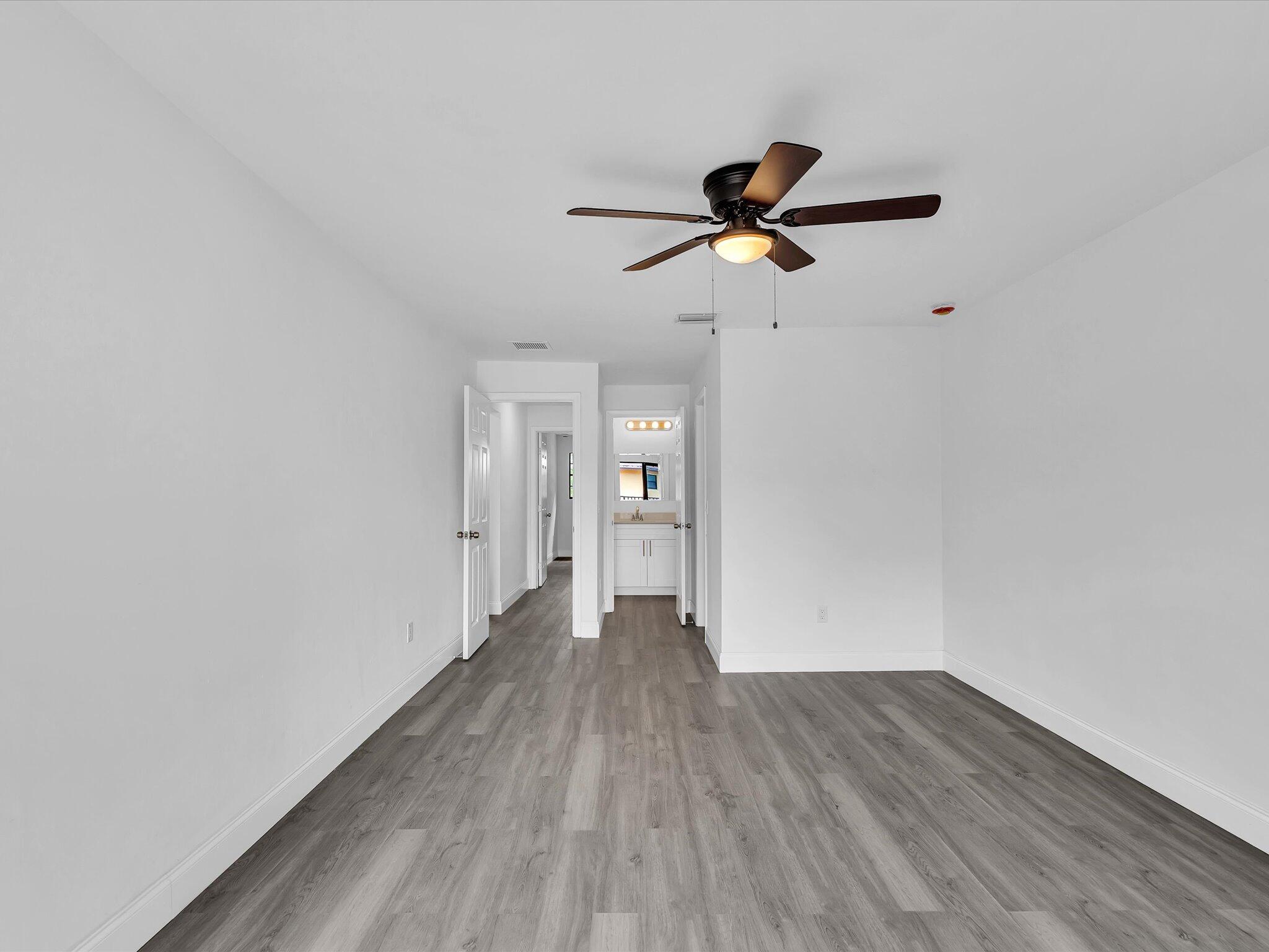3841 Farragut Street Hollywood, FL 33021 - Photo 23 of 47 a view of empty room with wooden floor