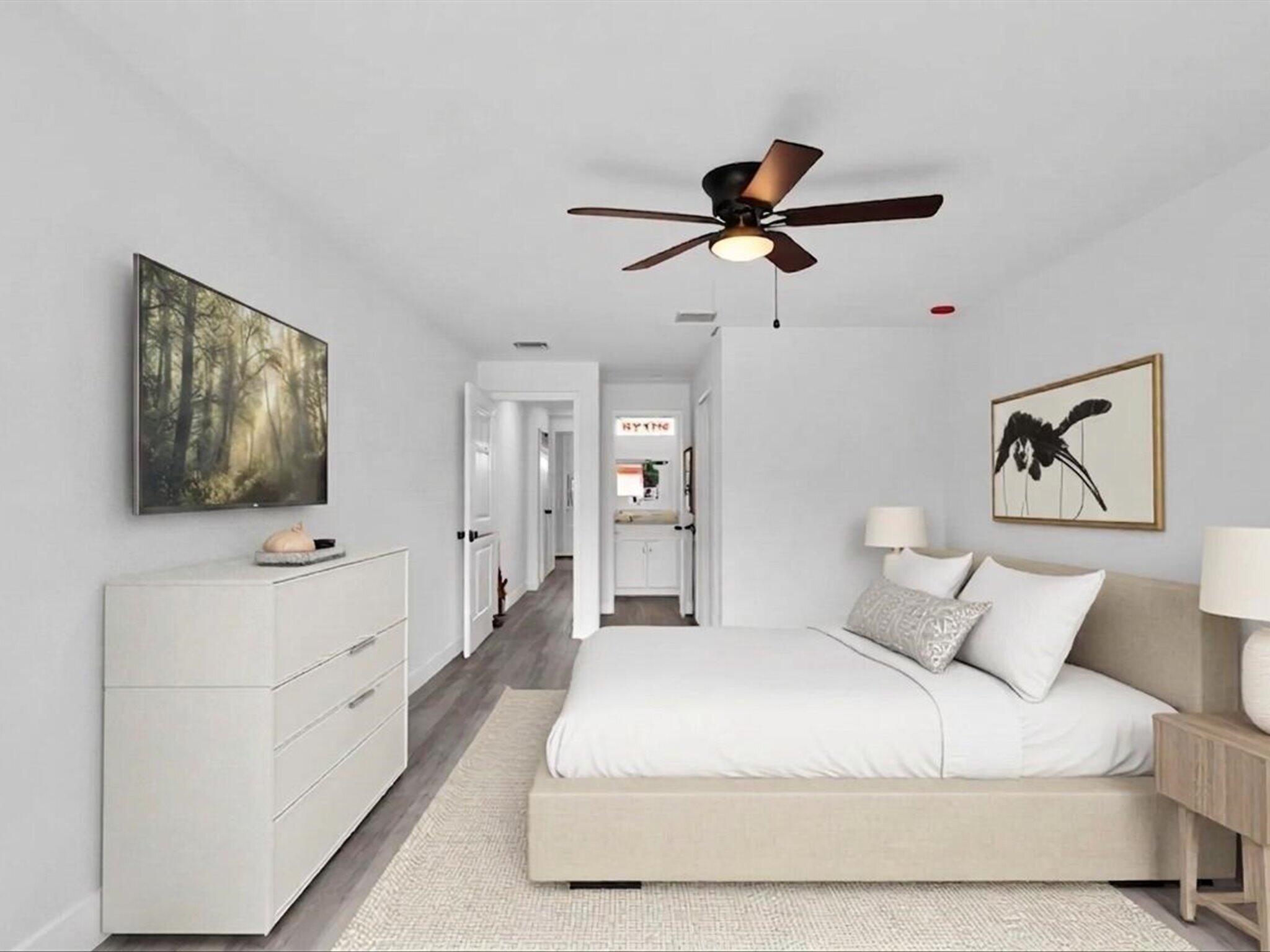 3841 Farragut Street Hollywood, FL 33021 - Photo 24 of 47 a bedroom with a large bed and a chandelier