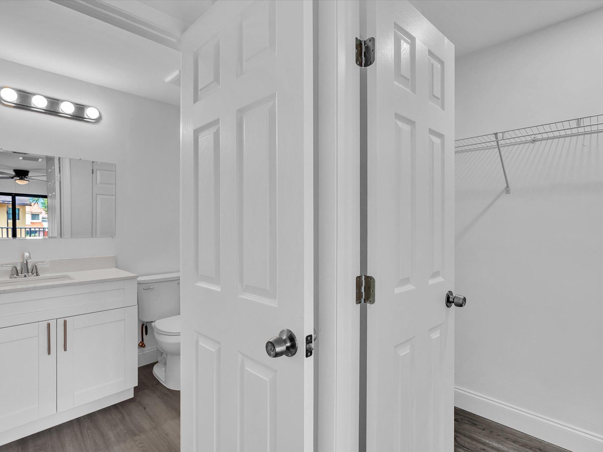 3841 Farragut Street Hollywood, FL 33021 - Photo 25 of 47 a bathroom with a granite countertop sink toilet and shower