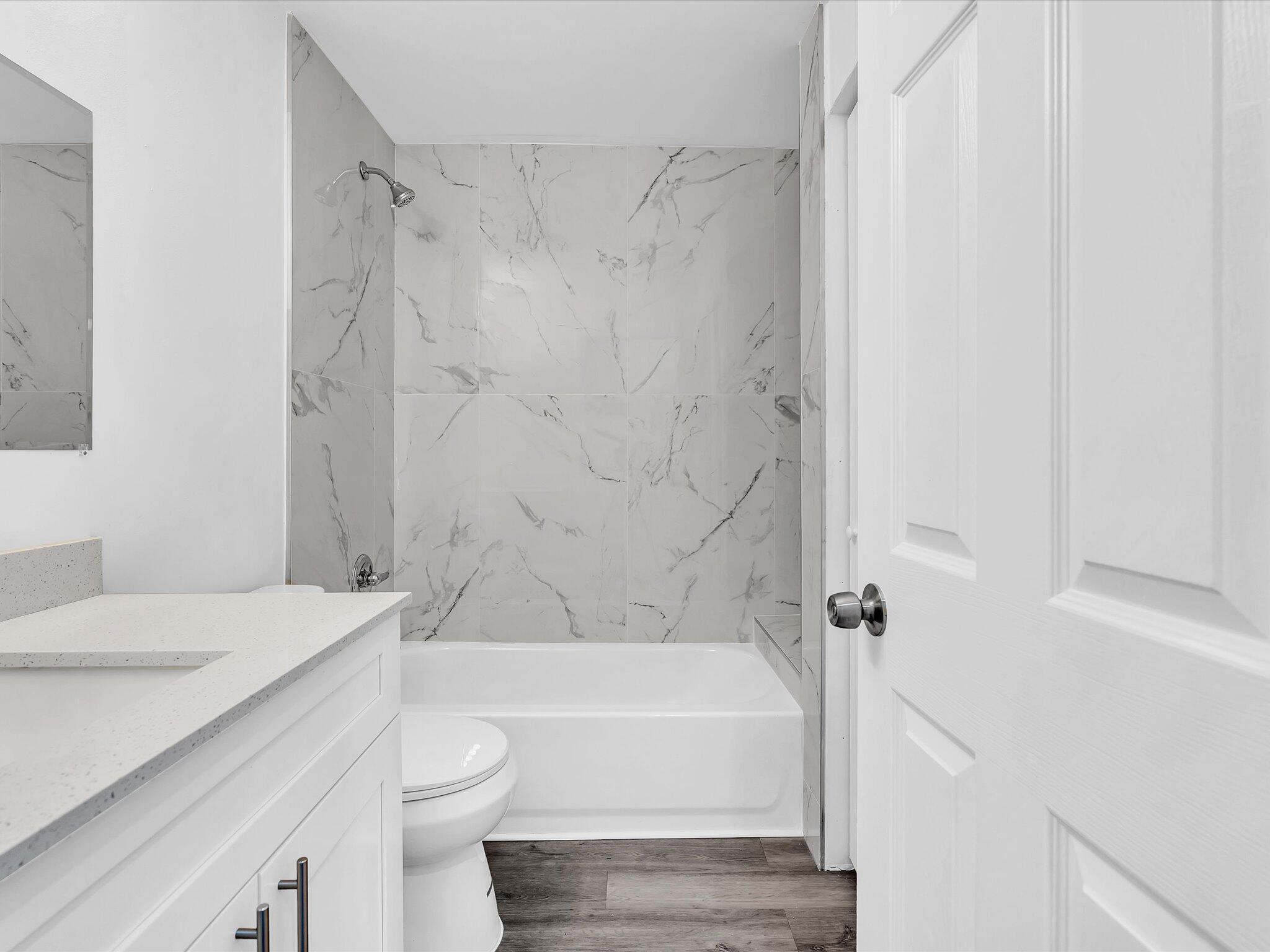 3841 Farragut Street Hollywood, FL 33021 - Photo 27 of 47 a bathroom with a sink a toilet and a bathtub