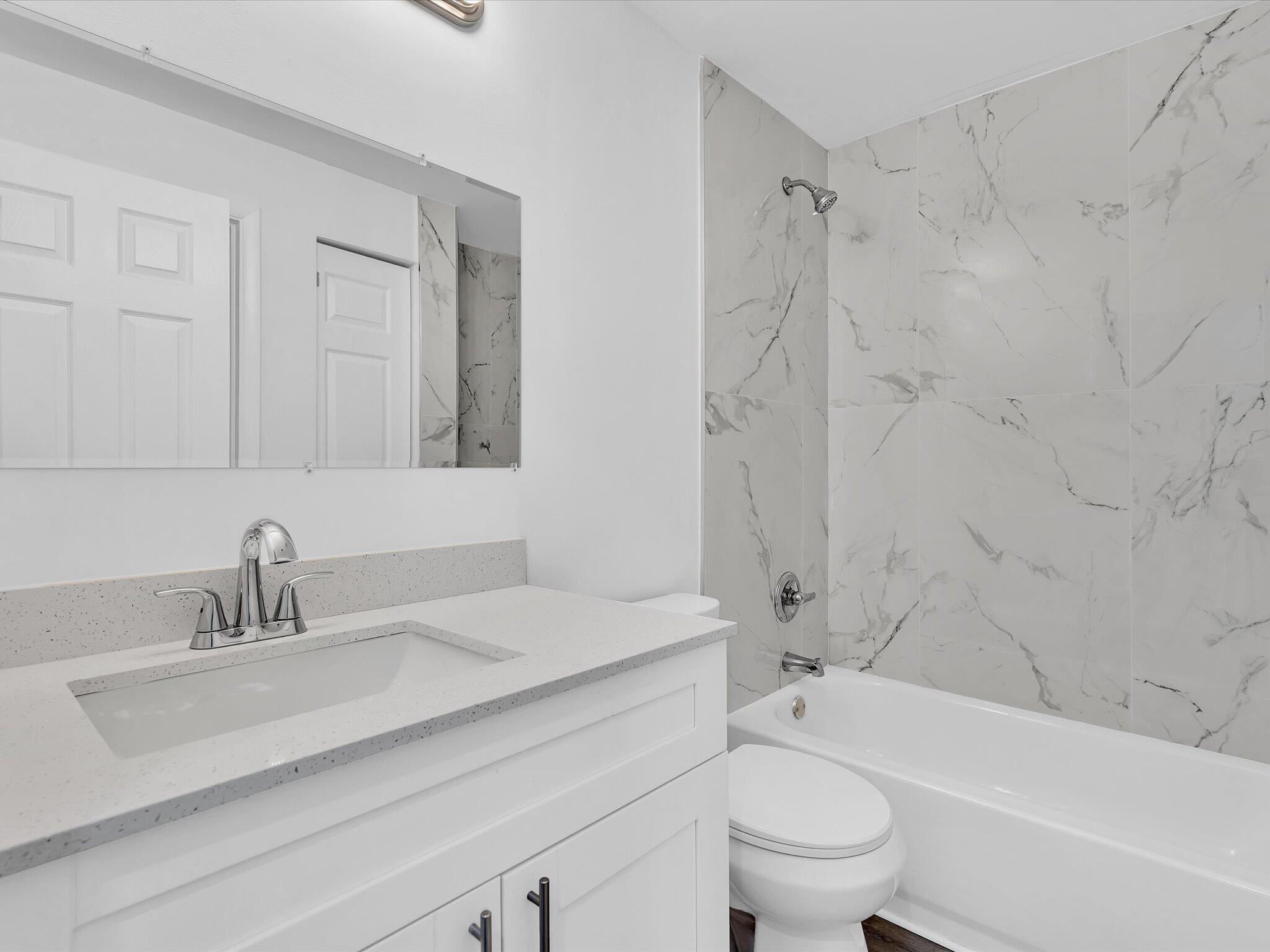 3841 Farragut Street Hollywood, FL 33021 - Photo 28 of 47 a bathroom with a sink a toilet and a bathtub