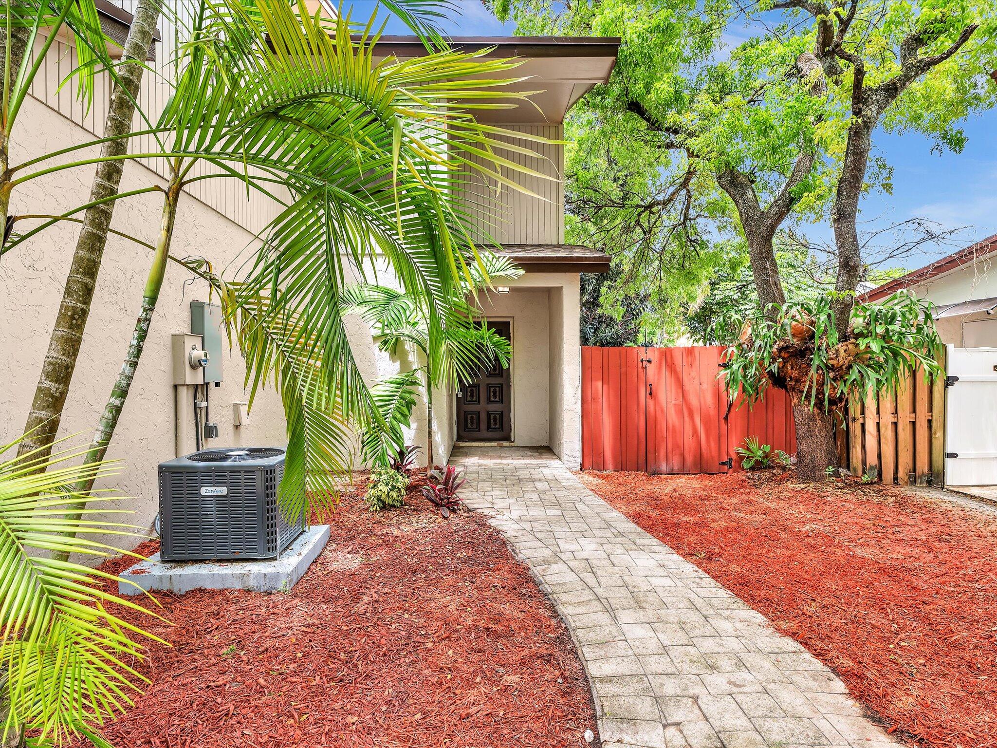 3841 Farragut Street Hollywood, FL 33021 - Photo 3 of 47 a view of backyard with a garden and trees