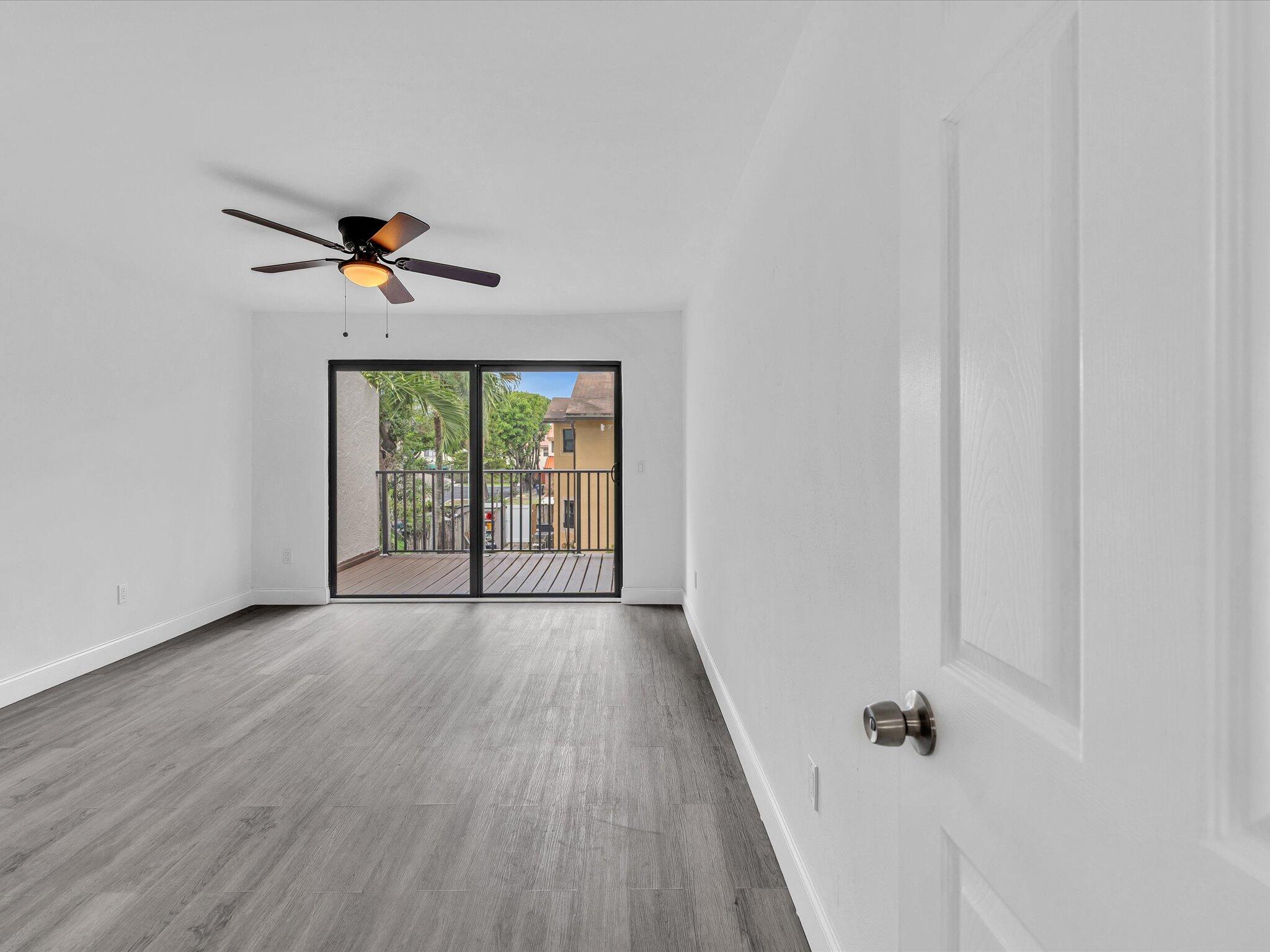 3841 Farragut Street Hollywood, FL 33021 - Photo 32 of 47 wooden floor in an empty room with a window