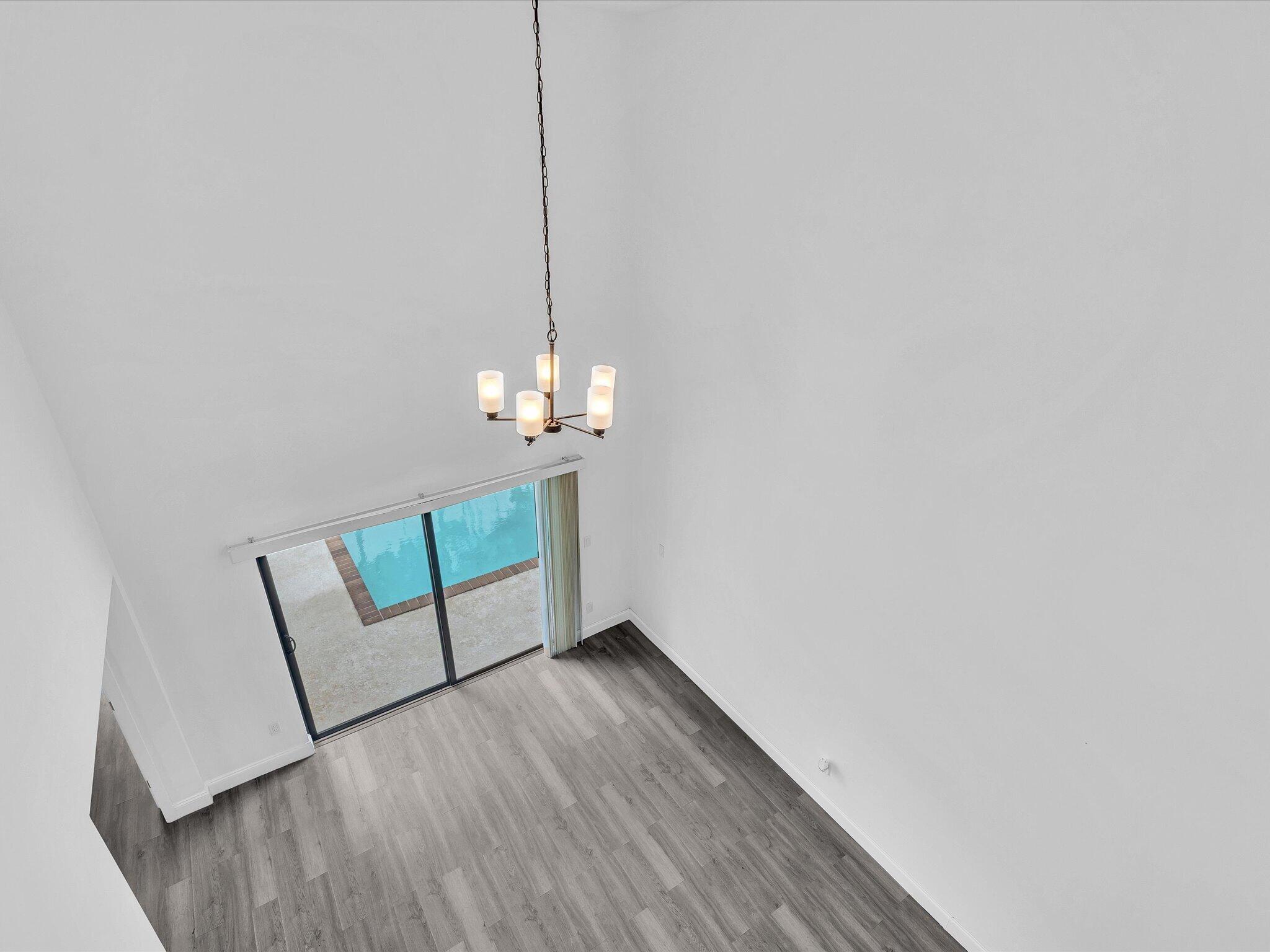 3841 Farragut Street Hollywood, FL 33021 - Photo 33 of 47 a view of an empty room with wooden floor and a window