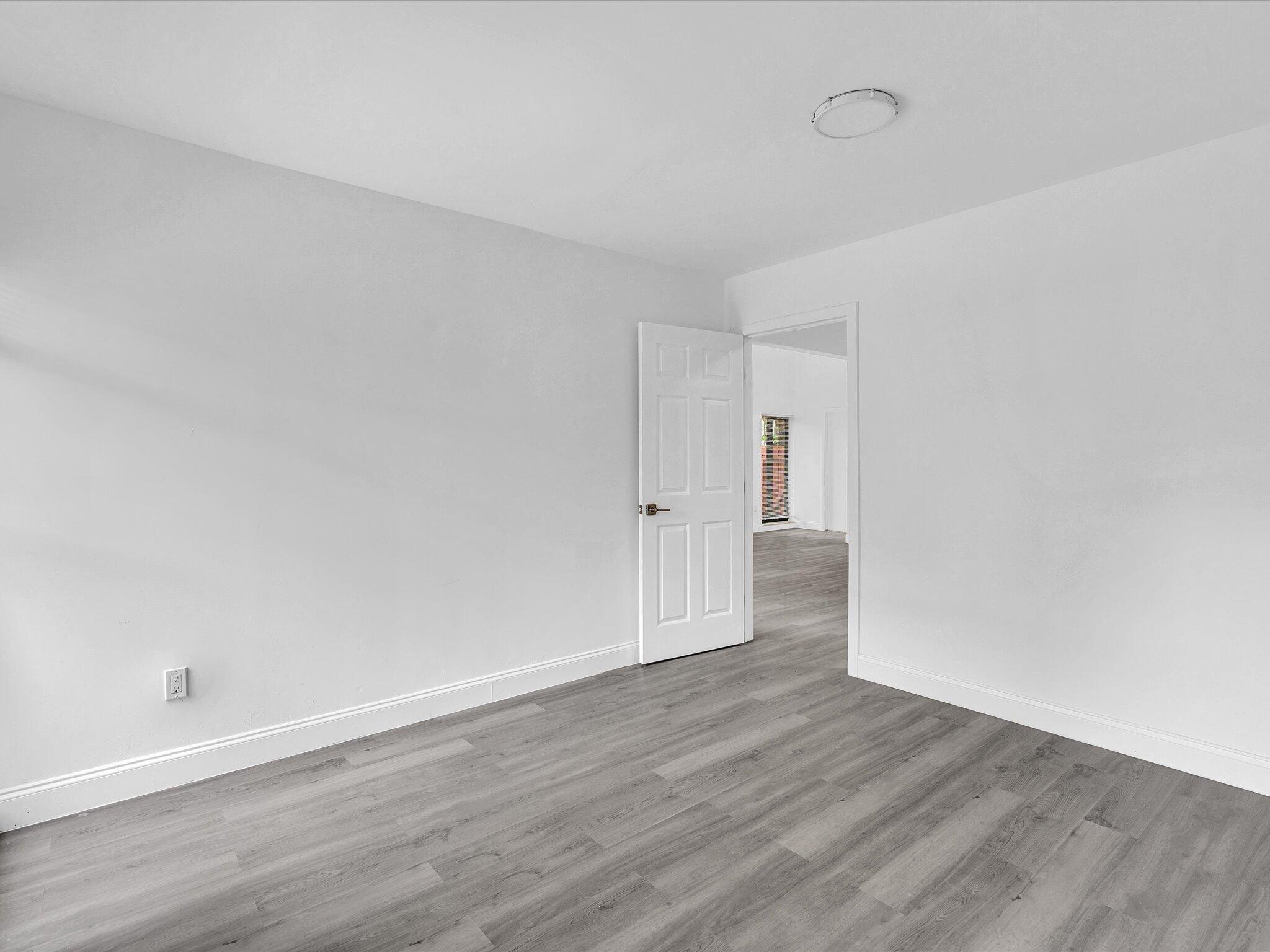 3841 Farragut Street Hollywood, FL 33021 - Photo 34 of 47 a view of an empty room with wooden floor